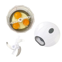 Quick pull chopper with clear bowl holding three eggs and white blade