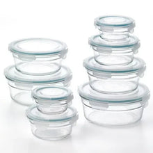 Stacked round glass food storage containers with clear snap-on lids, assorted sizes