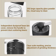 Clear glass grounds bin with black lid and removable handle on portable coffee grinder