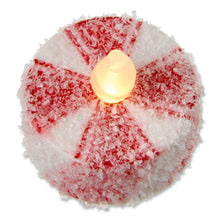 Flameless tealight with red-and-white frosted candy stripes and glowing LED flame
