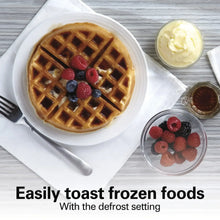 Waffle-style bagel on a plate with berries and a small dish of spread