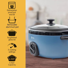 Blue slow cooker with glass lid, black control dial, and side handles