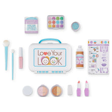 Pretend makeup kit pieces laid out: mirror, eyeshadow palette, blush, brushes, and lipsticks