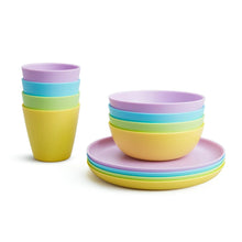 Multi-color toddler bowls and base plate set with stacked cups in purple, green, yellow.