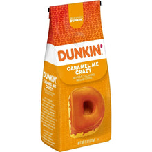Dunkin' Caramel Me Crazy ground coffee bag, front view with caramel-shaped logo