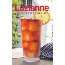Tall glass of iced tea with ice cubes and a lemon slice.
