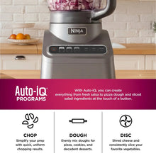Silver-gray food processor base with clear blending lid and front button panel