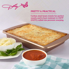 Rectangular non-stick cake pan with embossed butterfly base, holding baked bread, rose-gold.