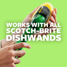 Dishwand refill head with green scouring pad attached to a handle