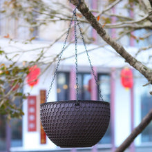 Self-watering hanging planter with chain hanger, textured hex pattern, dark basket