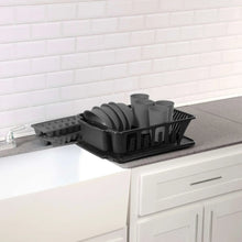 Black 12-piece kitchen set placed on countertop with dish rack and cup holders