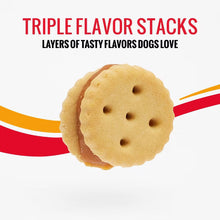 Round triple-flavor dog treat cookie with small holes and visible filling