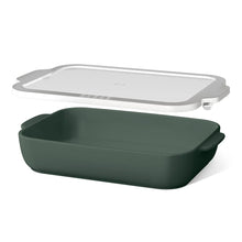 Green stoneware baking dish with white plastic lid