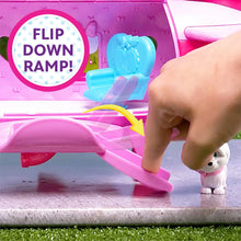Hand pressing the flip-down ramp on a pink Minnie jet playset