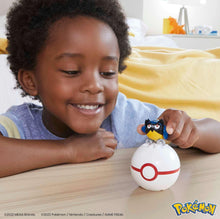 Rookidee figure placed on Poké Ball toy during play