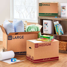 Kraft moving boxes in different sizes, featuring small box with green strip