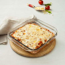 Square glass bake dish with clear lid, cheesy baked casserole