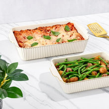 White ribbed stoneware baking dish set with lids, filled with roasted casserole