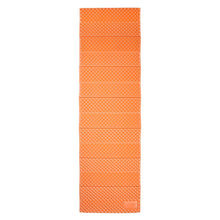 Foldable orange PE sleeping pad with textured bumpy surface, folded compactly