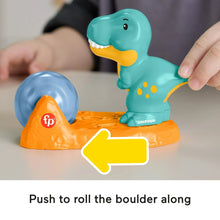 Toy dinosaur figure with orange boulder base and push-to-roll action piece