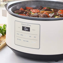 GreenPan slow cooker with lid open, showing beef stew and carrots inside.