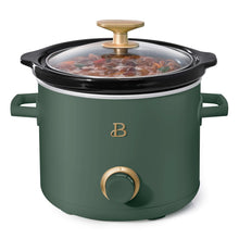 Green manual slow cooker with black lid, gold knob, and front dial