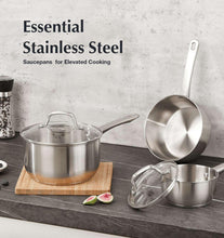 Stainless steel saucepans with lids, induction-ready cookware set.