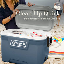 Blue hard cooler with open lid, Coleman badge, assorted cups and bottles inside