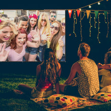 Portable projector screen showing a colorful outdoor party image