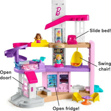Three-story dollhouse playset with slide, swing chair, open door, and kitchen accessories