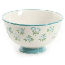 Floral ceramic dinner bowl with teal rim and foot, multicolor flower pattern