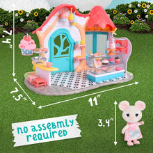 Miniature bakery dollhouse with pink roof, blue door, and food counter