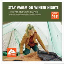 Tan cold-weather sleeping bag on a campsite floor inside a tent
