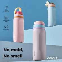 Insulated vacuum water bottles with straw lids, pink and blue tumblers on display
