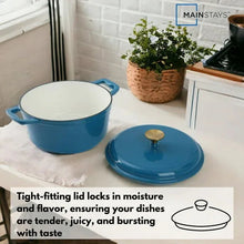 Blue Dutch oven with lid and two side handles, enamel interior visible