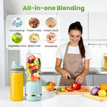 Portable blender with two cups and clear jar, shown blending smoothie ingredients