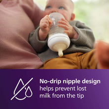 Bottle nipple with no-drip design icon beside a baby feeding