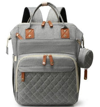 Light gray diaper bag backpack with front zip pocket and leather trim