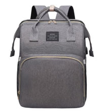 Gray multifunctional diaper bag backpack with front zip pocket and top handle