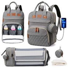 Gray diaper bag backpack set with bottle holder pockets, side compartments, and strap