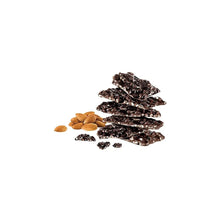 Stack of dark chocolate almond snack pieces with sea salt and almonds scattered
