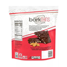Dark chocolate almond sea salt bark in retail pouch with almonds and red branding