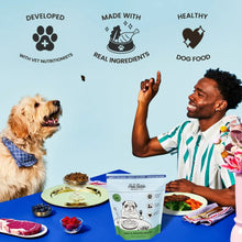 Air-dried dog food pouch on table with dog and person holding a bowl.