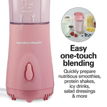 Coral personal blender with power button and clear blending jar under travel lid
