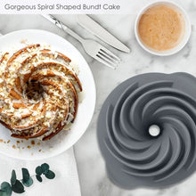 Silicone bundt cake pan with spiral pattern and central hole, dark gray