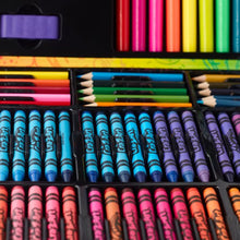 Close-up of colored pencils and crayon sticks arranged in the set tray