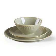 Green stoneware cup bowl, saucer plate, and dinner plate set with textured rim