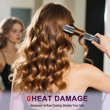 Airflow hair styler curling wavy hair while the vented barrel touches the strands