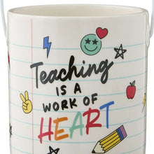 Ceramic pail close-up: Teaching is a work of HEART text and school icons
