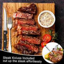 Steak knives and forks on a cutting board with dipping sauce